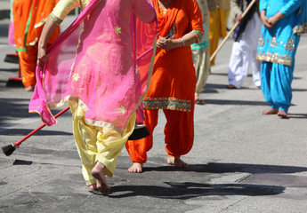 Sikh religion women during the ceremony  while sweeping the stre