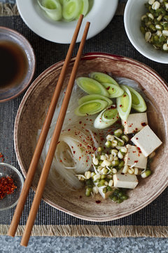 Asian noodle soup with smoked tofu and leeks