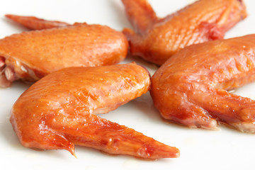 Grilled chicken wings on white background
