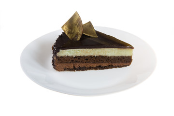 Biscuit cake with cream of white milk and black chocolate.