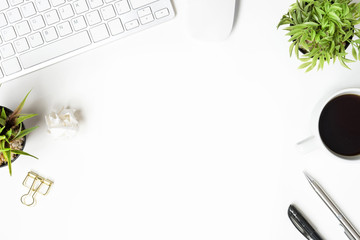 White office desk table with computer gadgets and supplies. Top view with copy space, flat lay.