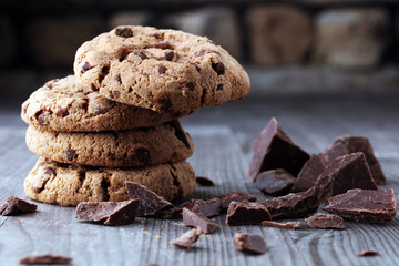 Chocolate cookies on wooden table. Chocolate chip cookies shot.