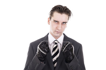 Elegant killer holding metal cable. Isolated on white background.