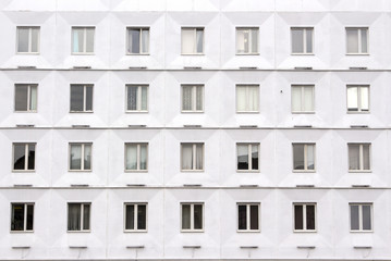 Fototapeta premium White building full of windows. Full frame of building.