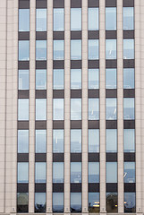 Building full of windows.  Full frame of building.