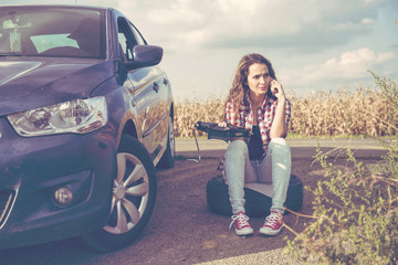 Beautiful young woman on the road, problem with her car