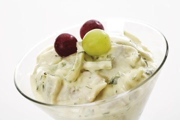 Swedish dill snack topped with grapes in a glass