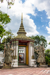 Fototapeta premium Ancient Chinese warrior (Demon) stone statuesat Wat Pho(Wat Phra Chetuphon Vimolmangklararm Rajwaramahaviharn) is the one of a famous Buddhist temple in Bangkok, Thailand