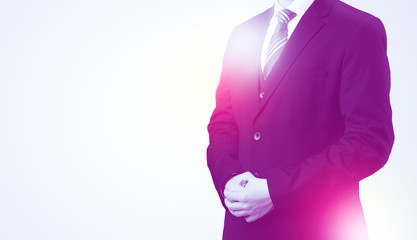 Young businessman standing and thinking