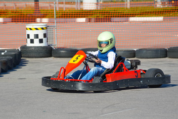 a teenager drives a cart