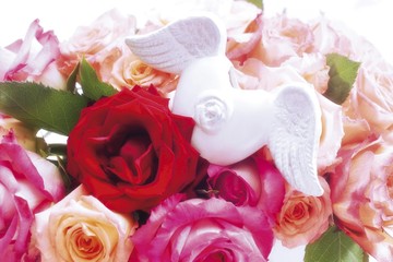 Winged heart in a bunch of roses