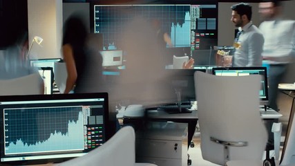 Timelapse of city stockmarket traders, at work in a chaotic trading room - Powered by Adobe