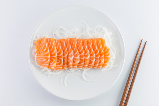 Salmon Sashimi, Raw On A Plate On A White Background