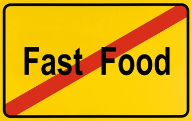 Sign, end of city limits, as symbol for the end of Fast Food