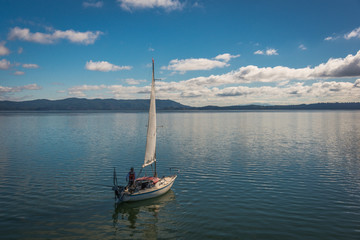 sailboat fishing calm bay