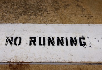 No Running Sign Painted on Pool Deck
