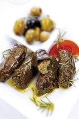 Stuffed vine leaves, olive oil, olives, rosemary, greek speciality