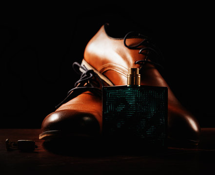 men's shoes and accessories on wooden background