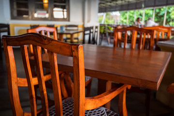 Cafe interior with wooden tables and chairs