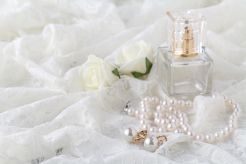 Wedding lace garter and perfume waiting bride. Selective focus.