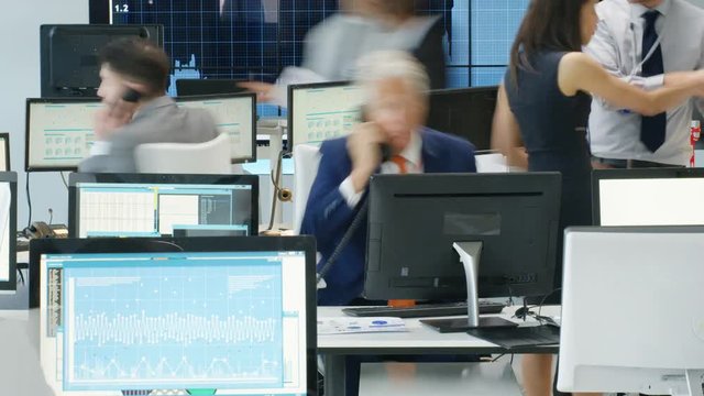 Timelapse of city stockmarket traders, at work in a chaotic trading room