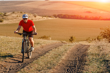 Fototapeta na wymiar mountain bike sport athlete man riding outdoor. bicycle travel concept