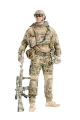 Full length low angle studio shot of big muscular soldier in field uniforms with sniper rifle,...