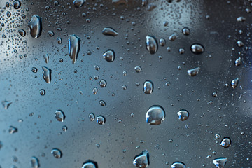 Abstract blue background with transparent water drops