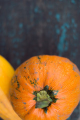 Pumpkin on wooden boards with a blurred background.