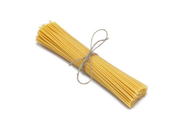 Bunch of spaghetti tied with rope isolated on a white background
