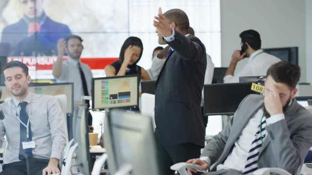  Financial traders watching the world markets react as the market crashes