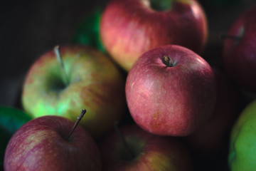 Fresh ripe apples on a wooden background. Autumn still life.