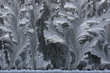 Tracery on a frosted window pane - frost patterns