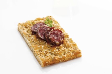 Crispbread with sliced salami