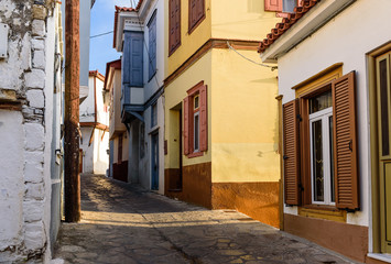 picturesque street in the village of Vathi with its traditional Greek houses, Samos town, Samos island, Greece 