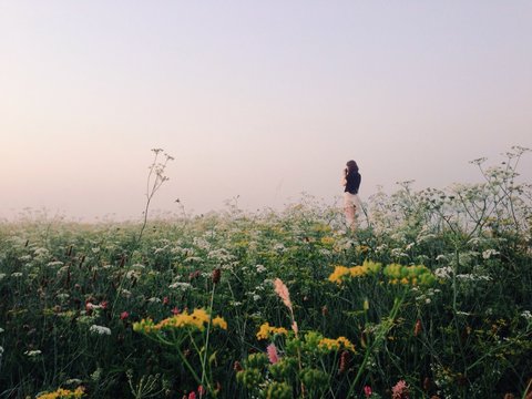 Woman taking pictures in the morning