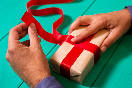 Man wraping a christmas present