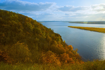 Naklejka premium Autumn landscape with mountains in the water spaces