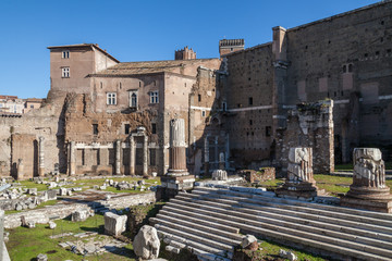 a view of ancient ruins in Roman Forum in Rome, Italy on a sunny summer day