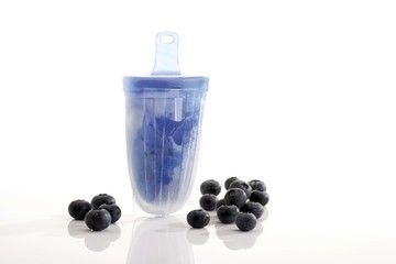 Homemade popsicle, ice lolly or ice pop mould, fresh blueberries