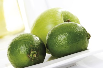 Green fruit, apple and limes