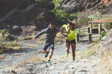 two friends young  running on the forest