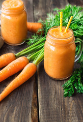Fresh carrot smoothie in jars