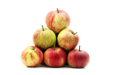 Red apples in heap isolated on a white background