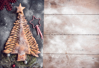 Homemade sweet Christmas tree on wooden background with blank space
