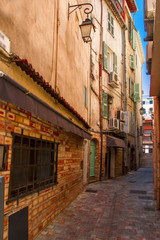 Fototapeta na wymiar Narrow old street in the old town Cannes, France