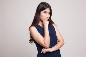 Obraz premium Serious young Asian woman look away.