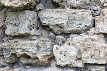 Fragment of an old wall from dolomite close up