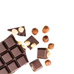 Pieces of bitter dark chocolate cubes with hazelnut isolated on white background, top view