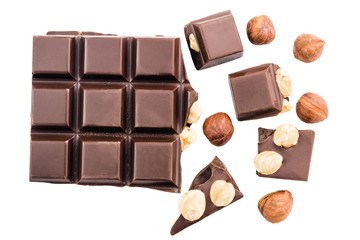 Pieces of bitter dark chocolate cubes with hazelnut isolated on white background, top view